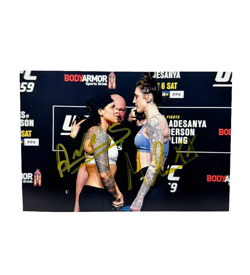 announcements/18146ac8-f193-4590-80a9-0a4ce5f29b37/1789504938683-foto-amanda-nunes-megan-anderson-autografado.webp