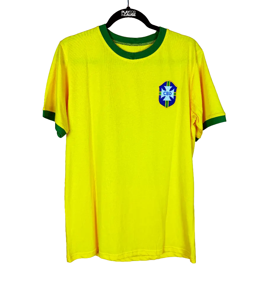 announcements/3f8d503f-d364-4507-a589-dc3c8a15c885/1790959610251-camisa-brasil-amarela-replica-pele-atuografada-1970-frente.webp