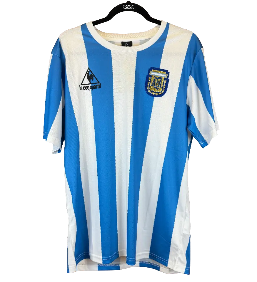 announcements/e62a3993-a483-49f0-871e-03ae4e89ec69/1791308259057-camisa-argentina-retro-1986-autografada-1.webp